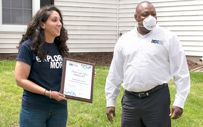 Shelby Hernandez received award plaque from Superintendent Dr. George Parker.